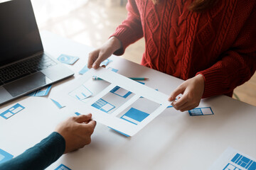 Designer, programmers, developers of mobile applications work together to invent a modern mobile...