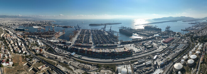 Aerial drone photo of industrial container logistics unloading import and export container terminal of Perama - Piraeus, Attica, Greece