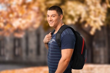 Happy young Student of university posing on outdoor