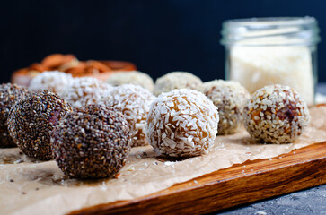 Assorted Vegan Sweets, Delicious Candy Balls with seeds, dried fruit, nuts, and cocoa powder, Healthy Candies