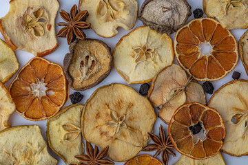Dried winter berries on a white background, apples, orange, pear, top view photo