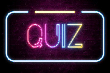 quiz text on the brick wall in realistic color neon glow