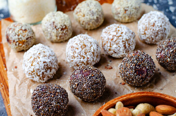 Assorted Vegan Sweets, Delicious Candy Balls with seeds, dried fruit, nuts, and cocoa powder,...