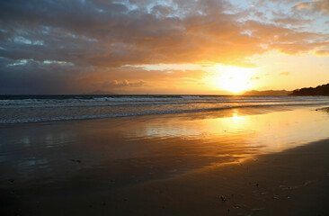Fototapeta na wymiar Sunrise on Waipu Beach, New Zealand