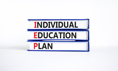IEP individual education plan symbol. Concept words IEP individual education plan on books on...