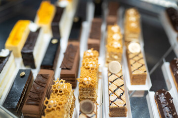 various delicious sweet pastries in the shop window.