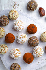 Assorted vegan sweets, Delicious Candy Balls with seeds, dried fruit and cocoa powder, Healthy Candies