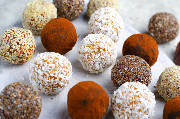 Assorted vegan sweets, Delicious Candy Balls with seeds, dried fruit and cocoa powder, Healthy Candies