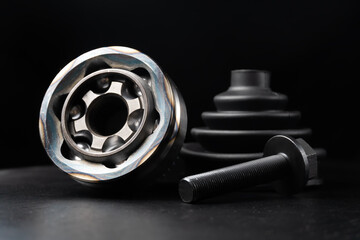 Car CV joint. Drive shaft connection on black background. New constant velocity joints. New...