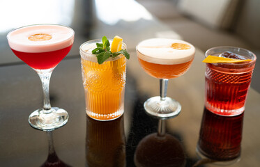 beautiful and delicious alcoholic cocktails prepared at the bar by the bartender.