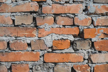 texture of old cracked and destroyed red brick wall