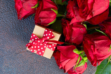 Crimson red rose flowers bouquet with gift box, Valentine's Day background