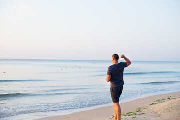 The guy throws a coin into sea