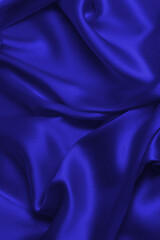 Rich and luxury red silk fabric texture background.