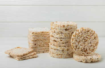 Stack of crispy rice cakes on white texture wood. Diet bread. Diet. proper nutrition. GLUTEN FREE. Copy space. Place for text.