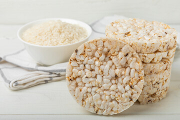 Stack of crispy rice cakes on white texture wood. Diet bread. Diet. proper nutrition. GLUTEN FREE. Copy space. Place for text.