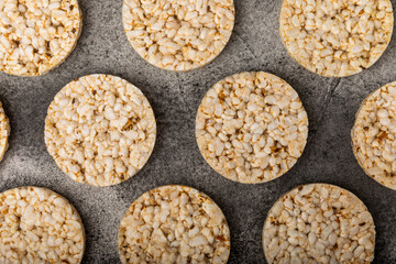 Stack of crispy rice cakes on black textured background. Diet bread. Diet. proper nutrition. GLUTEN FREE. Copy space. Place for text.