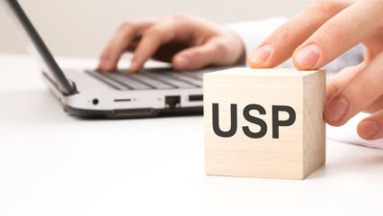 USP text wooden block on white table background. Idea, strategy, advertising, marketing, keyword and content concept