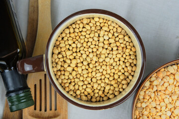 Soy in bowl. Protein pulse that is dried and then soaked and cooked before eating. Vegetarian organic product. Top view.