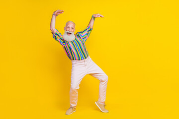 Fototapeta na wymiar Full length photo of sweet cute man wear colorful shirt enjoying discotheque having fun empty space isolated yellow color background