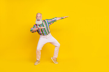 Fototapeta na wymiar Full length photo of charming sweet man wear colorful shirt dancing discotheque having fun empty space isolated yellow color background