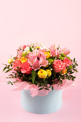 Bouquet of pink, yellow roses and purple flowers alstroemeria on a pink background. Birthday greeting card, Valentine's Day, Mother's Day