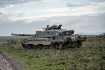 close-up of a British army Challenger 2 ii FV4034 main battle tank on a military exercise, commander and gunner scanning horizon