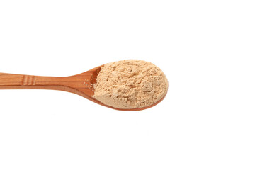 Maca gelatinized flour. Maca Powder in wooden spoon isolated on white, close-up. Peruvian superfood, natural organic supplement