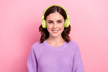 Photo of cute positive stylish lady wear trendy comfort spring jumper buy new accessory quality sound isolated on pink color background