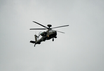 close-up of a British army Boeing Apache Attack helicopter (AH-64E ZM722 ArmyAir606) on approach to land, Wiltshire UK