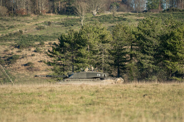 commander and gunner directing action in a British army FV4034 Challenger 2 ii main battle tank on...