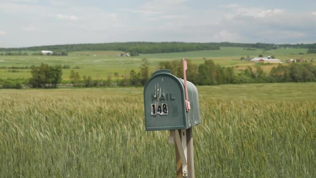 Mailbox flag up country field hay house summer spring wind