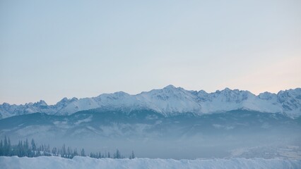 Fototapeta na wymiar FIXED Establishing shot, view of beautiful Tatra mountain range on a Poland and Slovakia border before sunrise