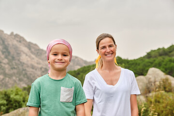 Portrait of a child with cancer in nature.