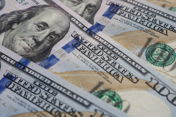 Closeup of hundred US American paper banknote currency. Global recession and inflation in the United States of America. Global financial crisis.