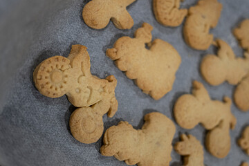 Home made biscuit cookies with different toy shapes like unicorns mermaids trains and motorbikes
