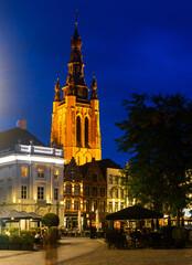 Night view of medieval gothic Saint Martins church and old buildings on Grote Markt, main square of Kortrijk, Belgium