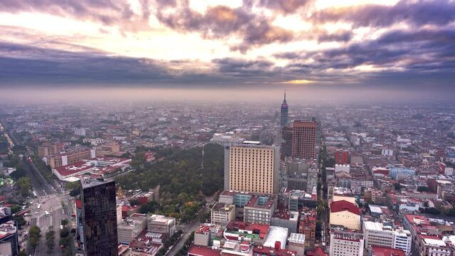 Downtown Mexico City at sunrise timelapse, can be appreciated Bellas Artes palace,  Latin American Tower and the Alameda.