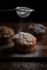 icing sugar on  homemade rhubarb muffins