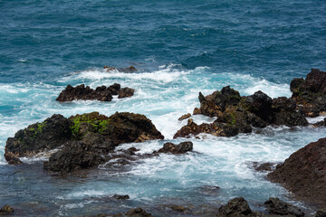 Lava stones in the surf