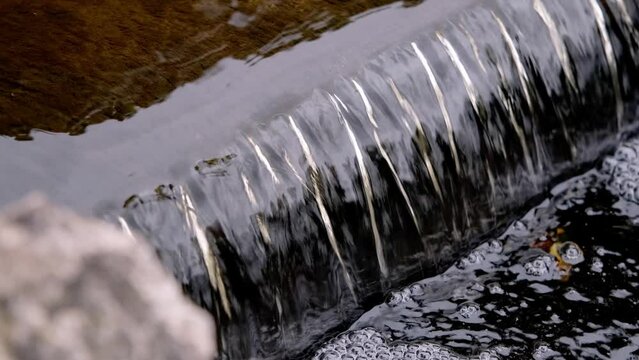 artificial waterfall in public park. landscape of beautiful Artificial waterfall in garden