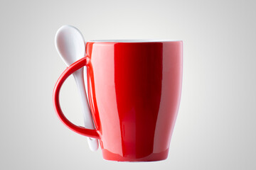 studio photography of a red cup with spoon,