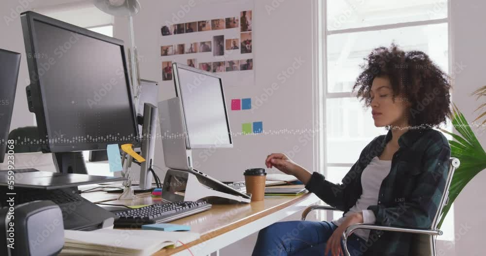 Aufkleber composite of financial data processing over businesswoman using computer in office