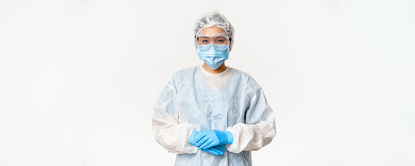 Portrait of asian doctor or nurse in ppe, personal protective equipment, standing in confident,...