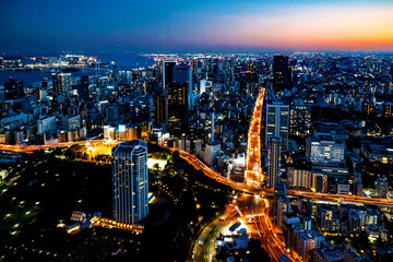 Naklejka na ściany i meble Aerial view of the skyline and cityscape at sunset in Minato, Tokyo, Japan