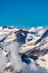 Fototapeta premium Switzerland 2022, Beautiful view of the Alps and Blue Sky around Titlis mountain.