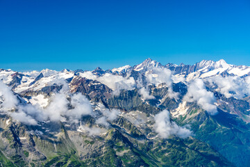 Fototapeta premium Switzerland 2022, Beautiful view of the Alps and Blue Sky around Titlis mountain.