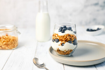Homemade granola with nuts and fresh blueberries for breakfast. Healthy breakfast. Vegetarian food concept