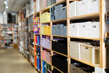 Various functional storage organizing boxes for sale in home furnishings store..