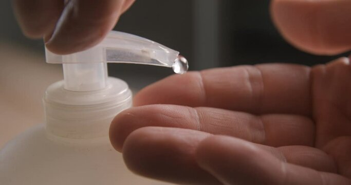 Liquid soap pumping on hands slow motion 4K